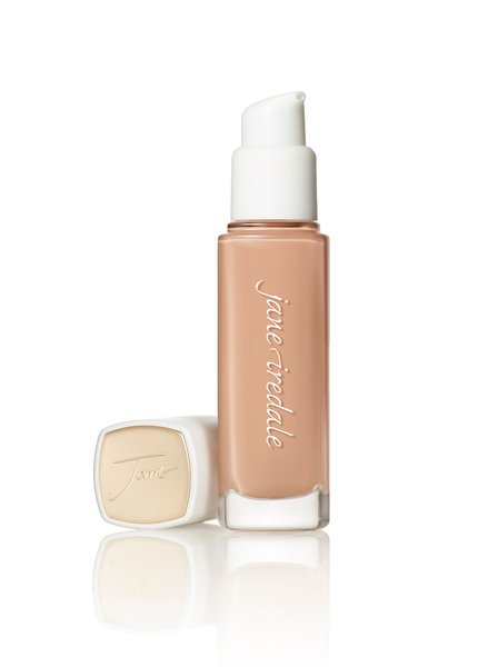 A pump bottle of Jane Iredale Skintuition SPF 30 Radiance-Boosting Liquid Foundation with the cap removed, showcasing the product color.